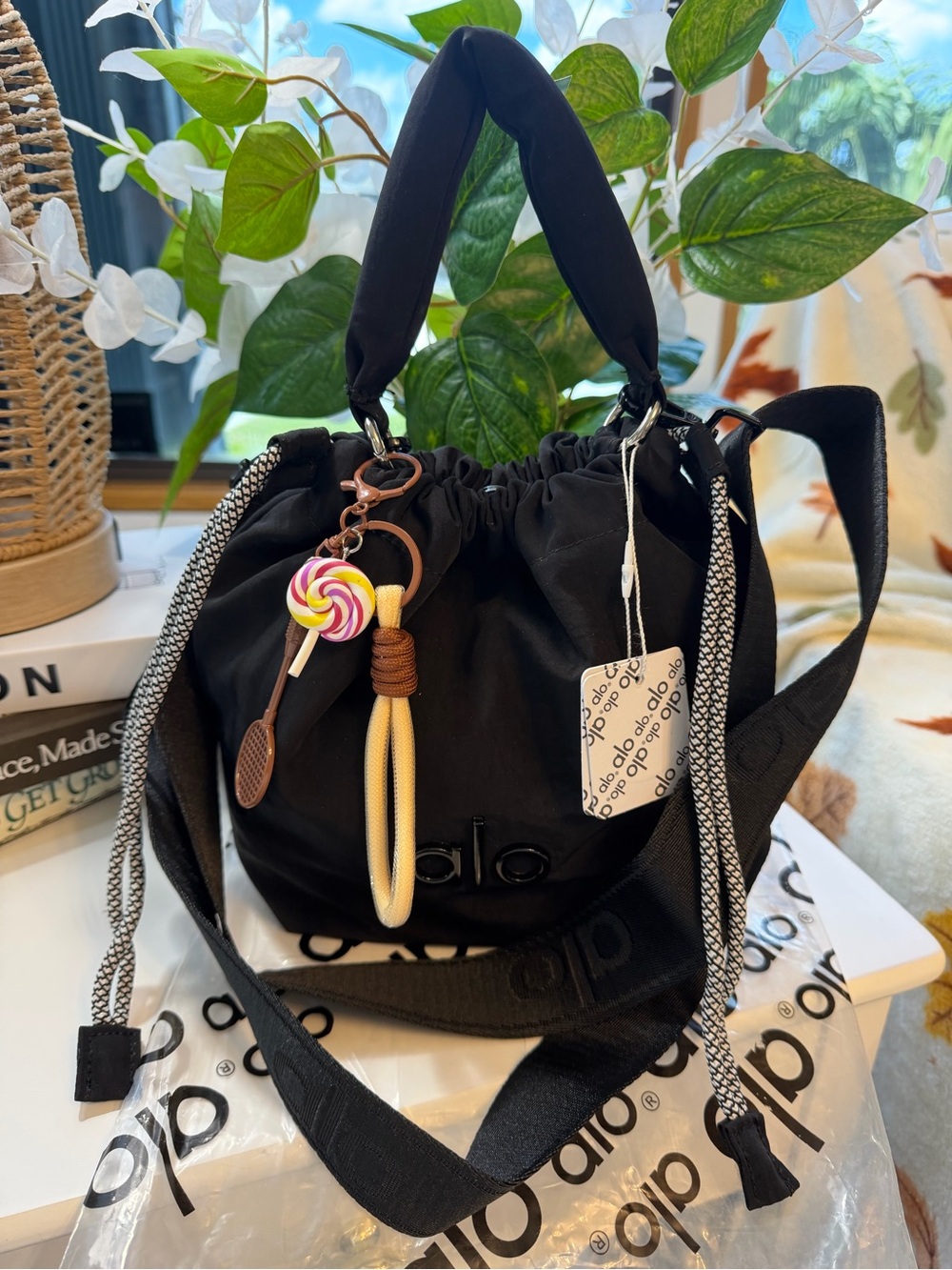 ALO Yoga Black Drawstring Mini Bucket Bag with Candy Charm - Picture 2 of 16